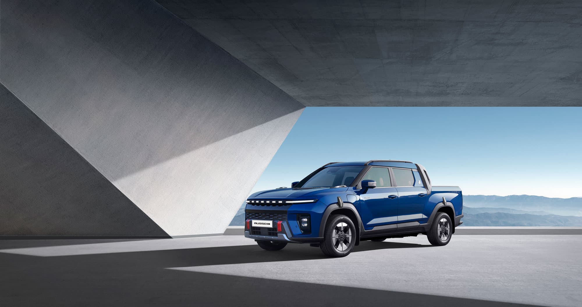 KGM Musso EV blue parked