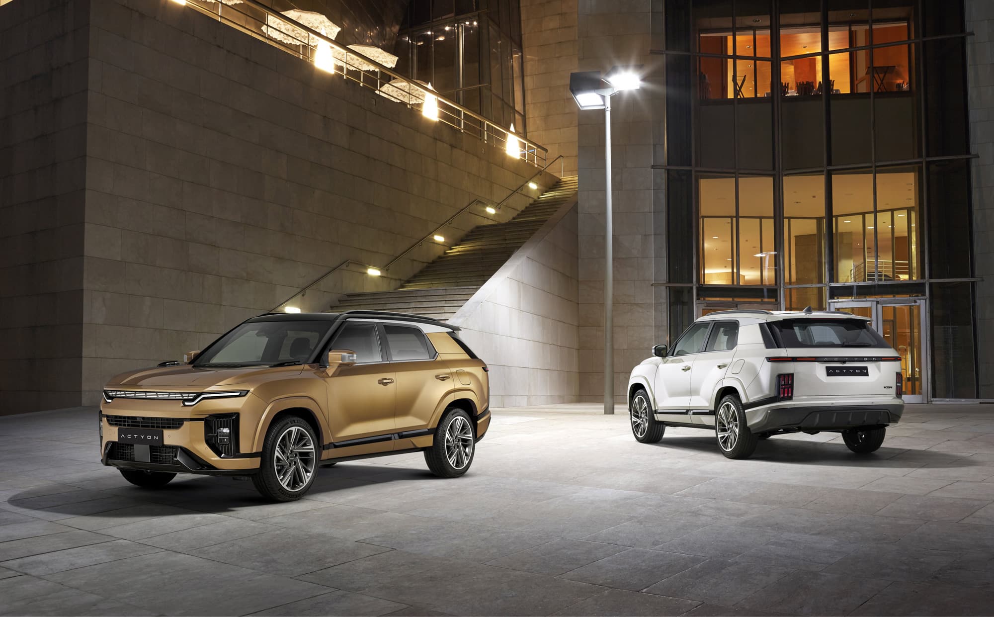 KGM Actyon two cars under streetlight