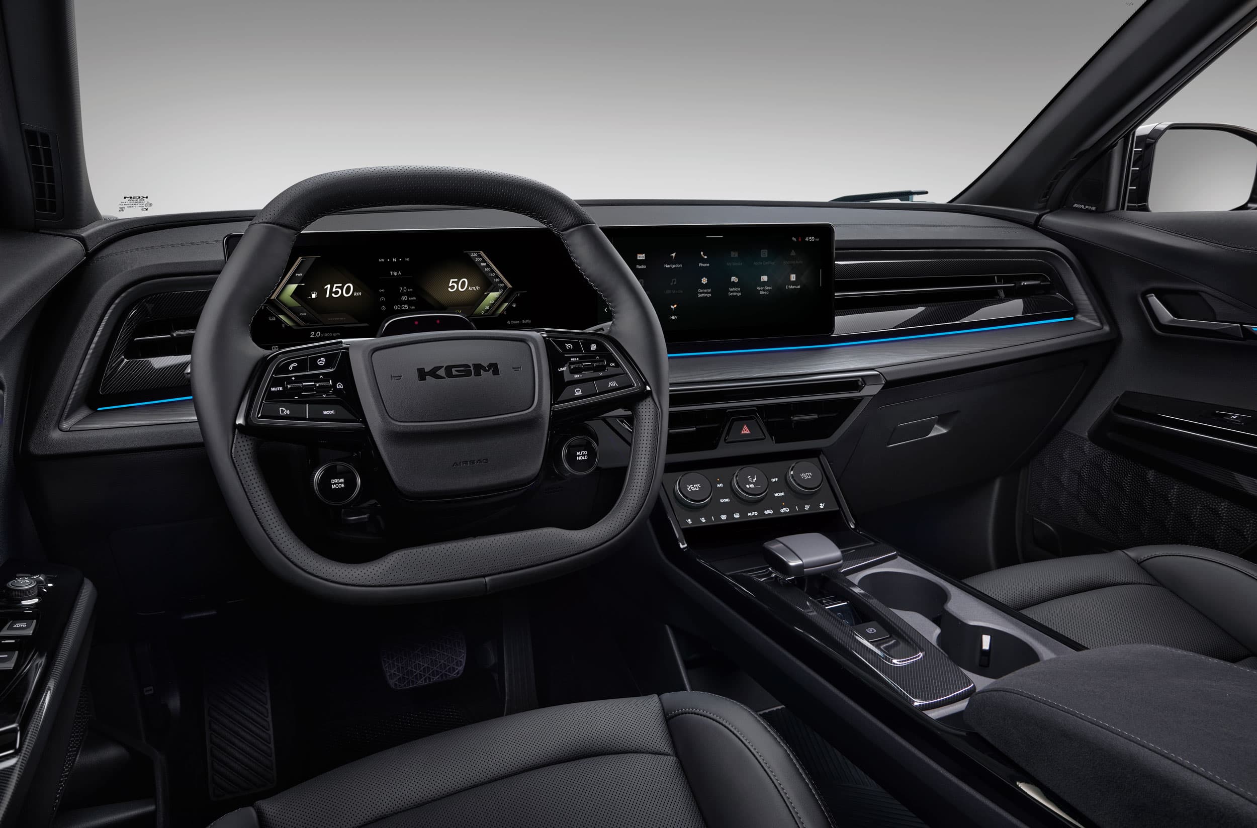 Modern KGM Actyon Hybrid interior with a digital dashboard, multifunction steering wheel, touch screen, and gear console in sleek black.